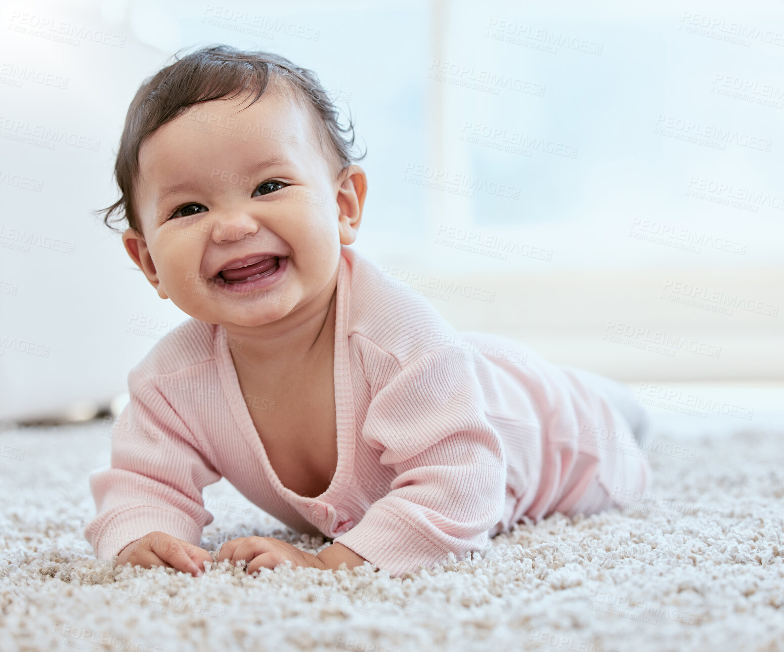 Buy stock photo Baby, floor and crawling with smile on carpet and learning to move, motor skills or early childhood development at home. Happy portrait of child relax on ground in living room for playing and growth