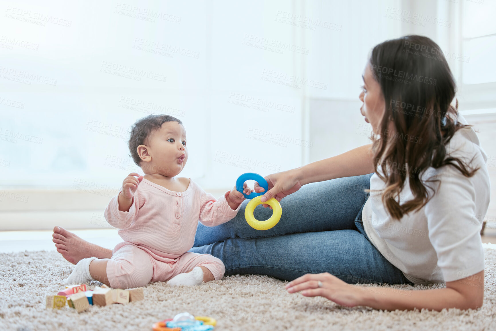 Buy stock photo Home, mom and baby with toys for bonding, playing and child development on floor in nursery. Happy, mother and infant daughter relax on carpet together with games for growth, motor skills or learning