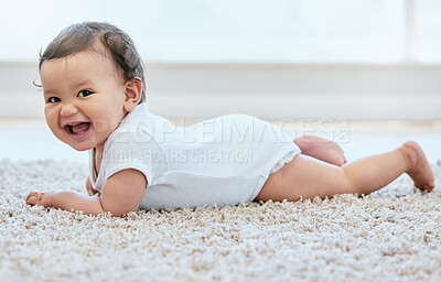 Buy stock photo Shot of an adorable baby girl crawling on the floor at home