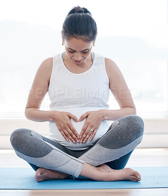 Buy stock photo Yoga, pregnancy and hands on stomach for woman, relax or health on floor for peace, future or mindset. Girl, pregnant pilates and zen meditation for mindfulness, hope or faith in gym, studio or house