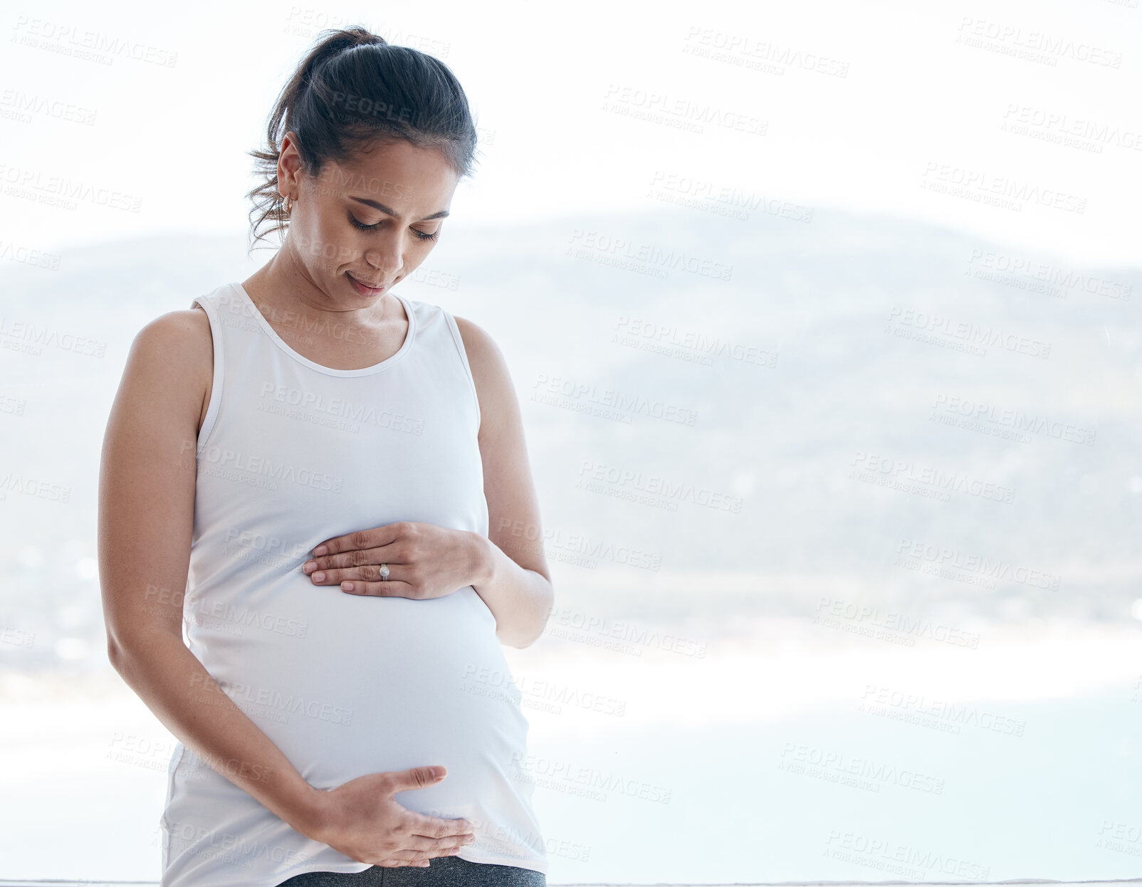 Buy stock photo Pregnant woman, thinking and holding stomach in home by window with mockup space for future, security and hope. Mother, person and touch belly for connection, growth and gratitude in morning at house