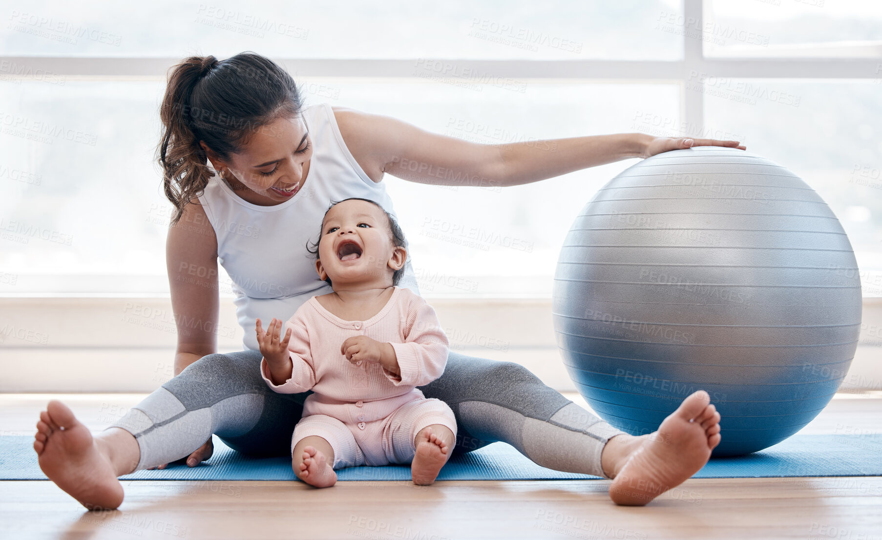 Buy stock photo Woman, happy baby and floor with exercise ball, laughing and bonding together with fitness, health and wellness. Workout, mother and daughter with happiness, home and excited face for training in gym