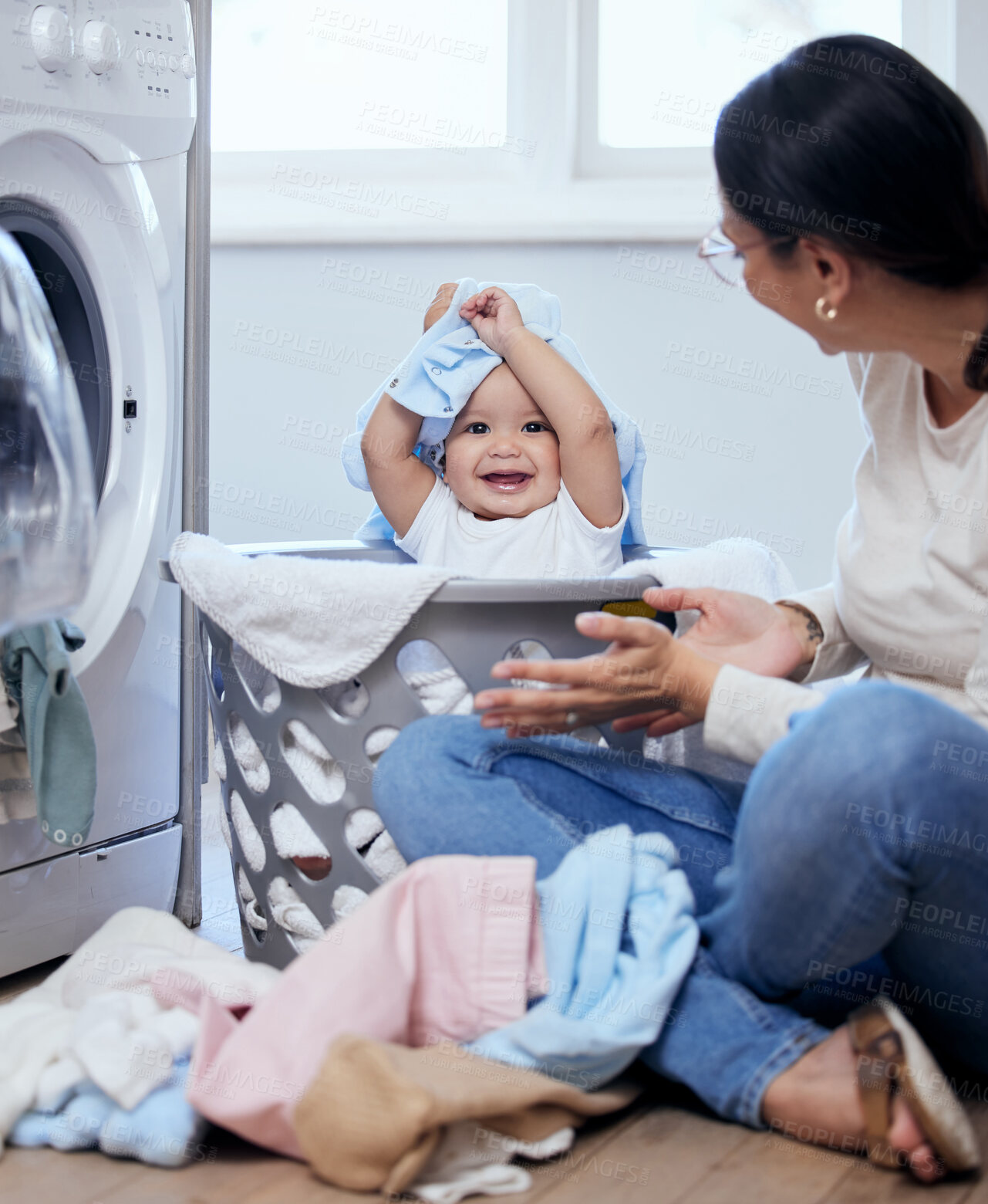 Buy stock photo Laundry, mom and baby in basket with fun, bonding and child development with happy toddler in home. Housekeeping, mother and infant girl playing together with clothes, washing machine and cleaning