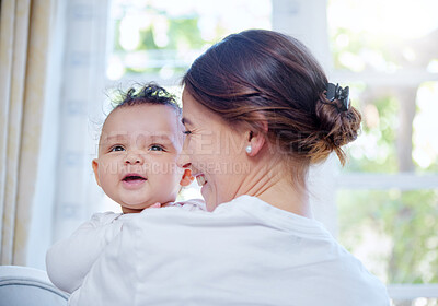 Buy stock photo Shot of a woman cuddling her baby