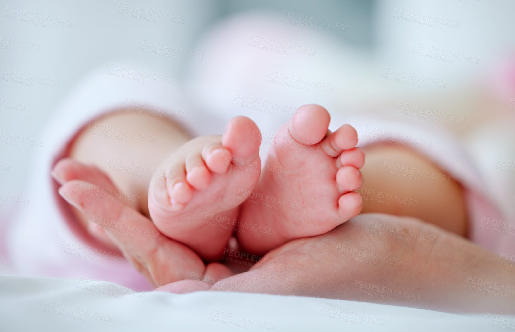Buy stock photo Baby, mother and holding feet in bed with closeup for care, connection and love in morning in home. Mom, infant child and together with bonding, development and growth in nursery at family house