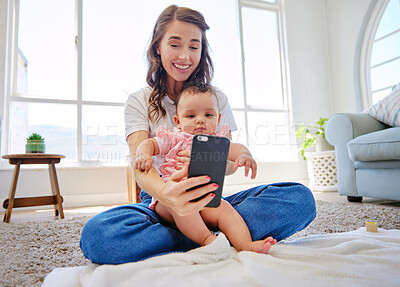 Buy stock photo Mother, baby and selfie with memory on living room floor, carpet or blanket for bonding together at home. Happy mom with young infant, hug or newborn in picture, photography or moment on mat at house