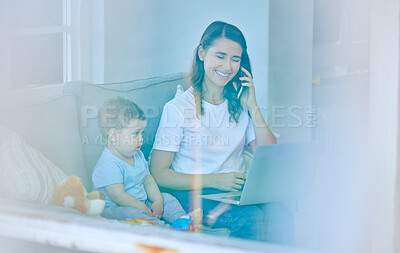 Buy stock photo High angle shot of an attractive young woman working on her laptop while looking after her baby boy