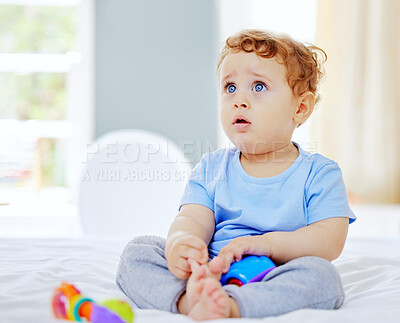 Buy stock photo Full length shot of an adorable little boy playing in his parents' bedroom at home