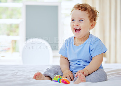 Buy stock photo Full length shot of an adorable little boy playing in his parents' bedroom at home
