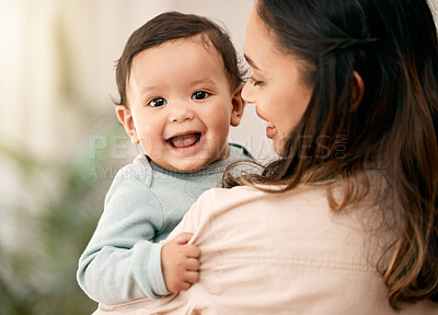 Buy stock photo Portrait, baby and mother hug with love, smile and playing during morning bonding routine in their home together. Family, face and mom with toddler in living room having fun, embrace and relax indoor