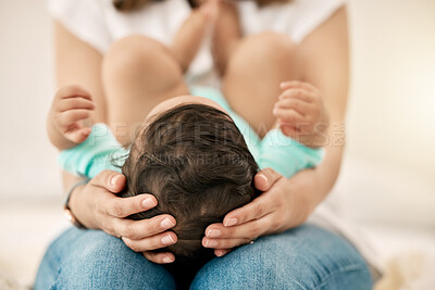 Buy stock photo Shot of a 
 mother holding her baby on her lap