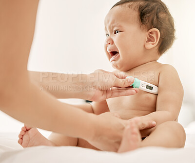 Buy stock photo Shot of a paediatrician taking a baby's temperature with a thermometer