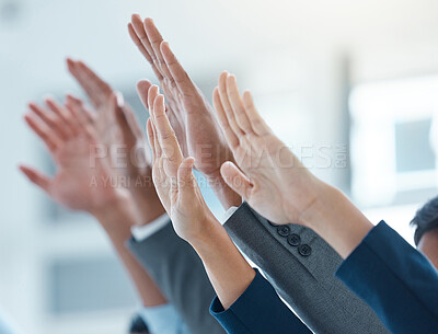Buy stock photo Shot of a group of business people with their hands raised