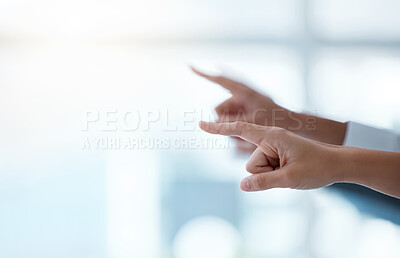 Buy stock photo Shot of a group of unrecognisable businesspeople pointing during a meeting in a modern office