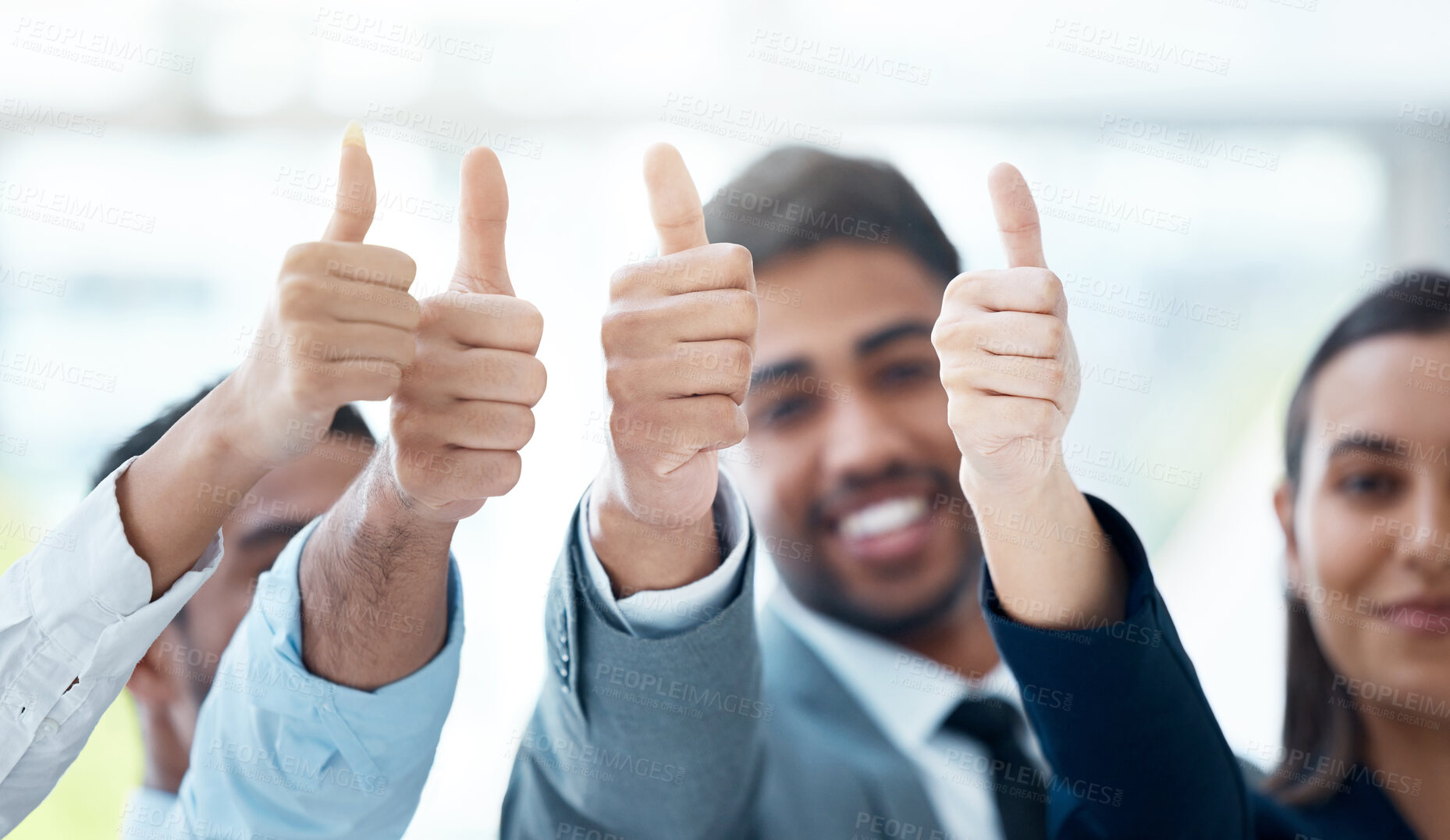 Buy stock photo Shot of a team of a group of unrecognizable colleagues giving the thumbs up