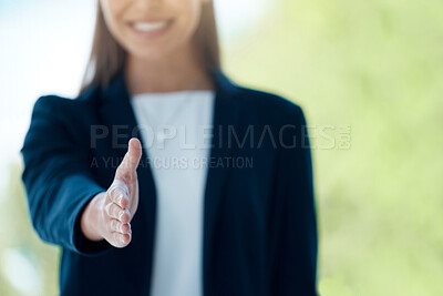 Buy stock photo Closeup shot of an unrecognisable businesswoman extending a handshake in an office