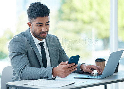 Buy stock photo Man with laptop, phone and desk at startup checking email, social media and search on internet with business plan. Online report, networking and businessman in office typing or reading on cellphone.
