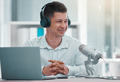 Buy stock photo Shot of a young man doing a broadcast in an office