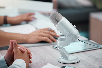 Buy stock photo Closeup shot of two unrecognisable men doing a broadcast in an office