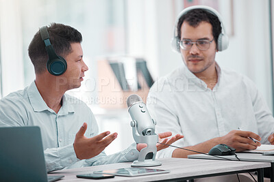 Buy stock photo Shot of two young men doing a broadcast in an office