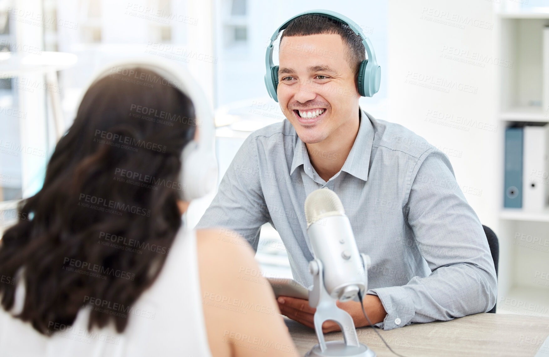 Buy stock photo Laughing, happy man or woman live streaming podcast or online radio on social media broadcast together. Funny influencer, teamwork or journalist reporters listening, discussion or speaking of comedy 