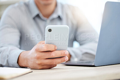 Buy stock photo Closeup shot of an unrecognisable businessman using a cellphone while working in an office