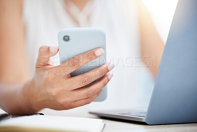 Buy stock photo Closeup shot of an unrecognisable businesswoman using a cellphone while working in an office