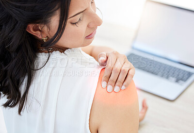 Buy stock photo Closeup shot of a young businesswoman experiencing shoulder pain while working in an office
