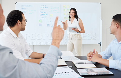 Buy stock photo Shot of a young businesswoman leading a meeting with her colleagues in an office
