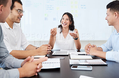 Buy stock photo Shot of a young businesswoman having a meeting with her colleagues in an office