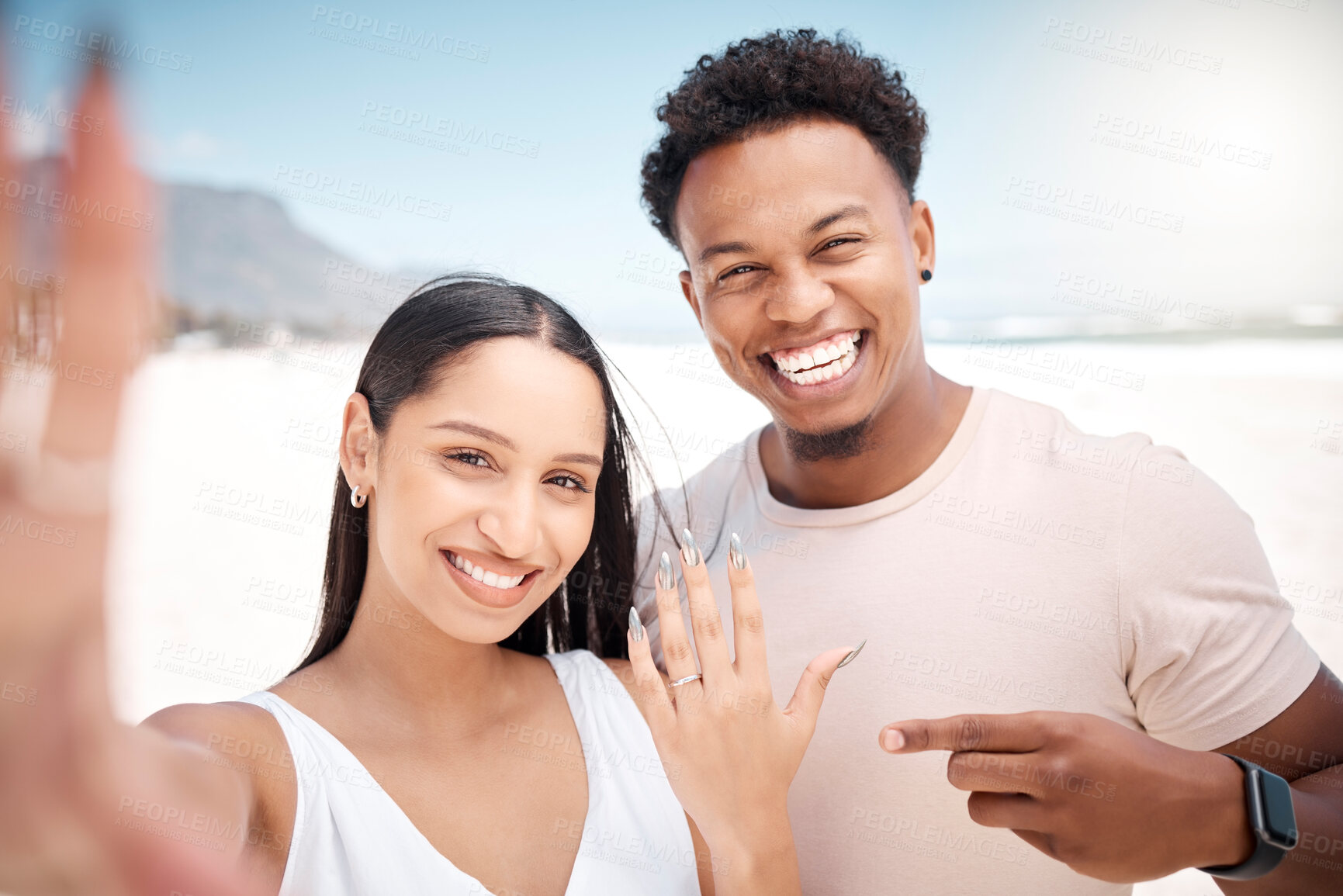 Buy stock photo Portrait, couple and selfie on beach with ring for announcement of engagement on social media and post. Man, woman and photography on summer vacation for memory of proposal, happy and celebration.