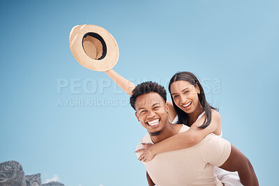 Buy stock photo Shot of a young couple having fun at the beach together