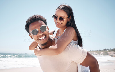 Buy stock photo Shot of a young couple having fun at the beach together