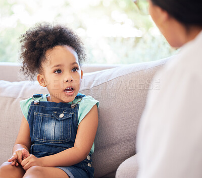Buy stock photo Shot of a psychiatrist talking to a little girl during a consultation