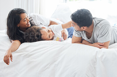 Buy stock photo Child, parents and family in bed for morning with love relationship, parent support and bonding together in home. Mother, father and young girl in bedroom for wake up with lazy weekend and relax