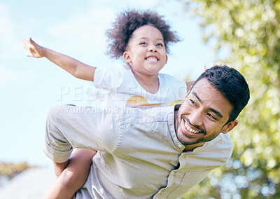 Buy stock photo Shot of man giving his daughter a piggyback ride