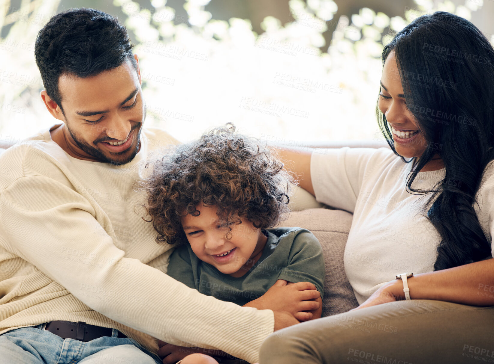 Buy stock photo Family, father and hug child on sofa house in living room bonding together, love and support on weekend. Smile, woman and boy with care, security and laugh on couch for trust embrace of memory