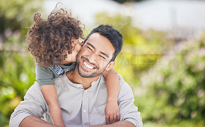 Buy stock photo Shot of a little boy giving his father a kiss on the cheek outdoors