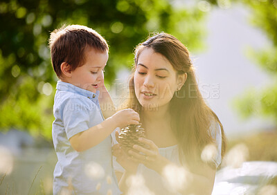 Buy stock photo Shot of a young mother and son spending time together in nature
