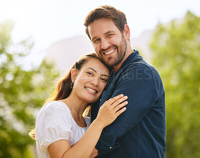Buy stock photo Shot of a young couple spending time together in nature