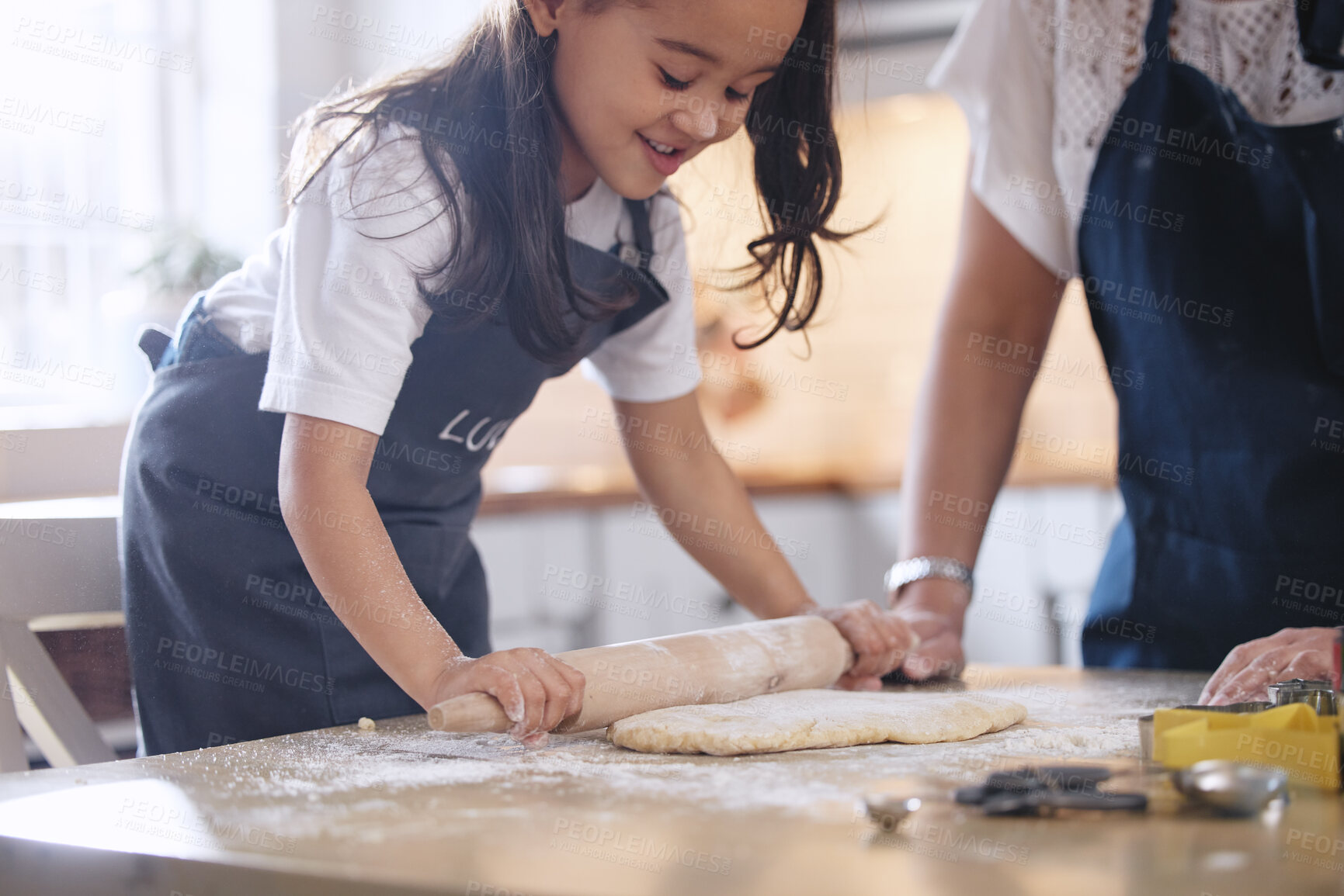 Buy stock photo Mother, child and rolling pin in kitchen for baking with helping and teaching cookie recipe in home. Mom, girl and making biscuit dough together for learning and relationship bonding with support