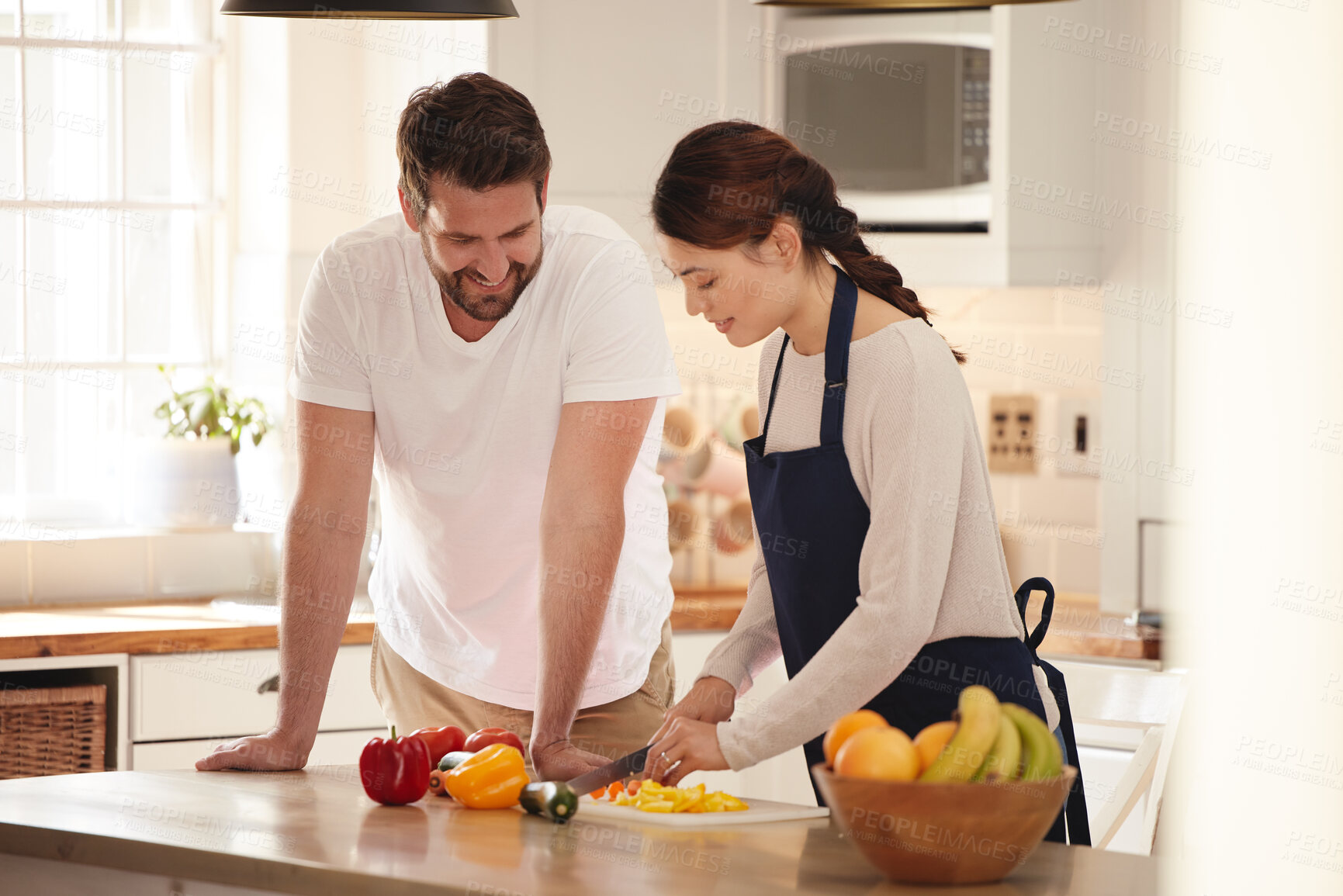 Buy stock photo Cooking, kitchen and couple cutting vegetables for healthy nutrition or wellness meal for dinner. Happy, love and young man and woman preparing produce ingredients for supper or lunch dish at home.