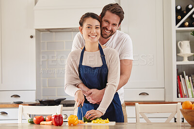 Buy stock photo Happy couple, cooking and embrace in portrait, kitchen in home for dinner, plans and family. Married people, vegetables and food or salad for healthy, eating or nutrition in house in chopping peppers