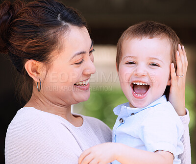 Buy stock photo Shot of a mother carrying her son on the porch at home