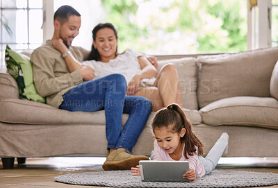 Buy stock photo Tablet, girl and child in living room with family for relax, learning or play game in home. Tech, kid and father with mother on sofa together for education, internet or reading story with parents