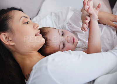 Buy stock photo Shot of a young mother and son spending time together at home