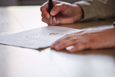 Buy stock photo Shot of a man signing divorce papers