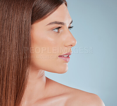 Buy stock photo Studio shot of a beautiful young woman showing off her sleek brown hair