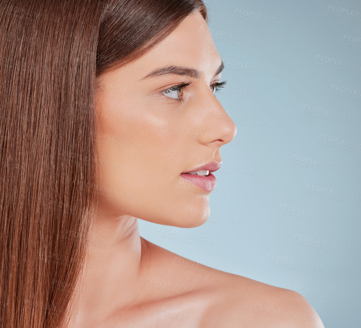 Buy stock photo Studio shot of a beautiful young woman showing off her sleek brown hair