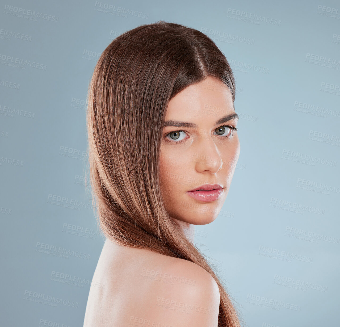 Buy stock photo Hair care, pride and portrait of woman in studio for salon treatment, growth and confidence. Serious, face and female person with wellness for shampoo shine, health and glow on gray background